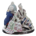 19th century German porcelain figural group, modelled as a lady sitting for an artist's portrait,