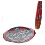 Poole Pottery 'Delphis' circular twin-handled platter, abstract on a red ground, factory stamp to