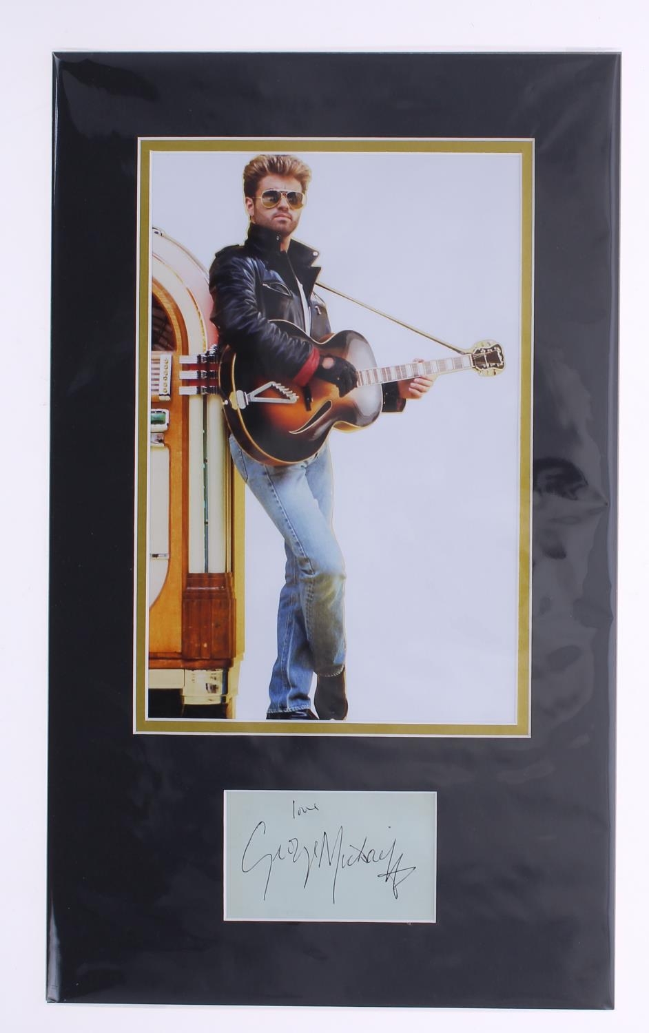 George Michael - autograph page inscribed 'Love George Michael', mounted beneath a coloured picture,