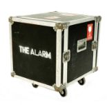 The Alarm - Heavy duty rack type flight case on wheels bearing a 'The Alarm' stencil to the front,