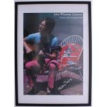 John Lennon - framed poster featuring a private photograph of John Lennon, signed by the