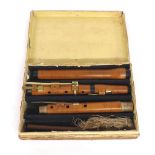 Boxwood flute with horn mounts and five brass keys (F key with double touch), stamped A.S. Wolf,