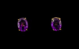 Pair of Oval Shaped Amethyst Set Stud Ea