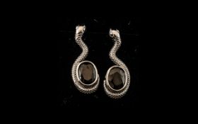 Shungite Serpent Drop Earrings, an oval