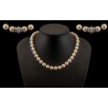 A Superb Quality Single Strand Cultured Pearl Necklace with 14ct White Gold Diamond Set Clasp.