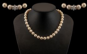 A Superb Quality Single Strand Cultured Pearl Necklace with 14ct White Gold Diamond Set Clasp.