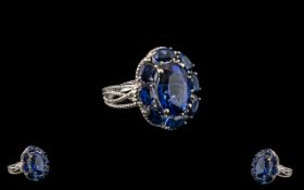 Ceylon Blue Coloured Quartz Cluster Ring, 10.25cts; a statement ring comprising a 6ct oval cut