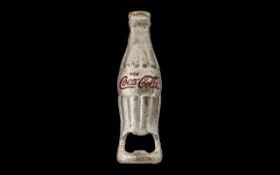 Coca Cola Bottle Opener. Cast metal Coca Cola bottle opener, 4.4" in length.