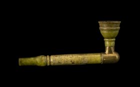 Chinese Antique Green Jade Opium Pipe of Traditional Shape, the bowl supported by a brass mount.