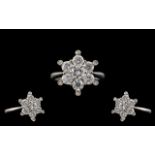 18ct White Gold Superb Quality and Attractive Starburst Diamond Set Ring. The Round Modern Brilliant