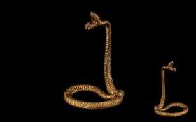 A Cast Novelty Watch Stand in the form of a Snake.