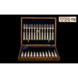 A Superb Quality Boxed Set of 24 Silver and Pearl Handles Fish Knifes and Forks. Hallmark