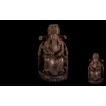 Antique Chinese Finely Carved Cherrywood Figure of a Seated Mandarin wearing a traditional hat with