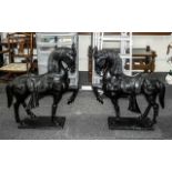 Pair of Large Cast Bronze Stylised Horses wearing decorative Oriental saddles with adornments; the