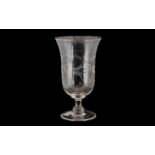 A Victorian Glass Celery Vase with etched decoration. Measures 8'' in height.