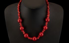 A Modern Cherry Amber and Coral Coloured Necklace. 18 Inches In length.