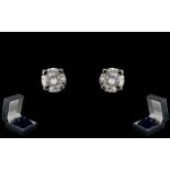 18ct Gold - Fine Pair of Diamond Set Stud Earrings. Marked 750 - 18ct. Est Diamond Weight 0.10 pts.