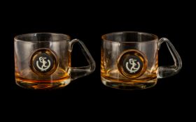 Two Glass Mugs with Wedgwood 'Olympic' Buttons to front.