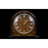 Small 1950s Oak Cased Mantle Clock with chrome numerals to the face and outer glass rim. Two hole