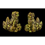Pair of Antique Chinese Foo Temple Dogs, with an unusual yellow and green splash glaze.