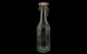 German Carlsberg Bottle with original Carlsberg stopper and embossed swastika emblem to base.