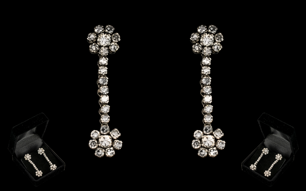 18ct White Gold Diamond Drop Earrings, Each Earring Having Two 8 Stone Flower Head Clusters