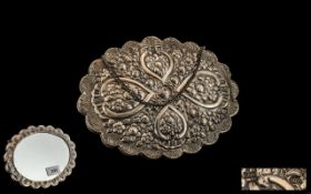 Turkish Silver Embossed Ottoman Design Shaped Hand Mirror, decorated to the body with flowers in