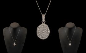 A Contemporary and Attractive 9ct White Gold CZ Set Hinged Locket with Attached 9ct Gold Chain.