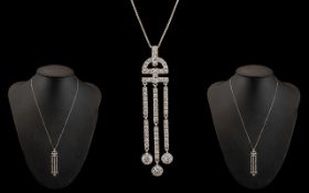 A Contemporary Designed and Attractive 18ct White Gold Diamond Set Pendant with Tazzel Drop,