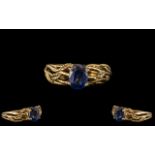 Unisex Sapphire 9ct Gold Dress Ring set with vibrant and lovely blue stone with leaf decoration to