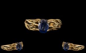 Unisex Sapphire 9ct Gold Dress Ring set with vibrant and lovely blue stone with leaf decoration to