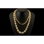 Antique Period Superb Quality - Long and Tactile Graduated Ivory Knotted Bead Necklace,