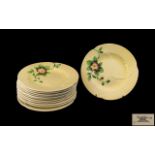 Twelve Carlton Ware Fruit Plates, Australian design, pale yellow ground with pink flower decoration.