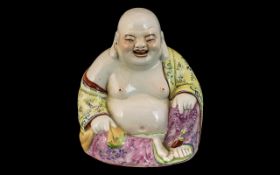 Small Chinese Republic Famille Rose Decorated Buddah Figure, sitting and smiling. Impressed marks to