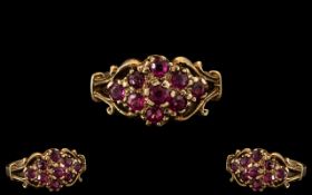 Ladies - 9ct Gold Attractive Ruby Set Cluster Ring with Fancy Setting. Full Hallmark for 9.375.