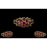 Ladies - 9ct Gold Attractive Ruby Set Cluster Ring with Fancy Setting. Full Hallmark for 9.375.