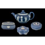 Collection of Wedgewood Pottery including tea pot and lidded pots, four pieces in total.