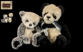 Two Charley Bears comprising an 18" black and white Panda Charley Bear with jointed limbs and a bow