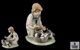 Lladro - Hand Painted Porcelain Figure ' Joy In a Basket ' Girl with Puppies. Model 5595.