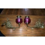 A Pair of Victorian Ruby Red Wall Bracket Oil Lamps with Ruby Font and brass filigree and Funnel,