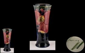 William Moorcroft Signed Early Vase of Tapered Form ' Pomegranates ' Pattern on Blue Ground. c.