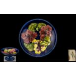 William Moorcroft Signed Tube lined Tazza with Hibiscus Pattern to Centre of Bowl on a Royal Blue