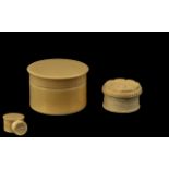 Two Ivory Lidded Pots, both of cylinder form, measure 2.25'' in diameter, please see images.