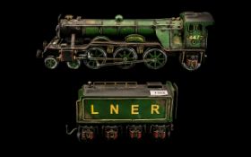 A Tin Plate Flying Scotsman Intender model locomotive, unmarked maker. Overall length is 26 inches.