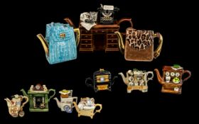 A Collection of Novelty Teapots to include, Portmeirion bookcase,