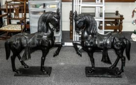 Pair of Large Cast Bronze Stylised Horses wearing decorative Oriental saddles with adornments; the