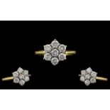 18ct Gold - Ladies Attractive 7 Stone Diamond Set Cluster Ring. Full Hallmark for 18ct - 750.