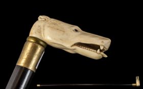 Carved Bone Walking Stick In The Form of a Dog. Carved Bone Walking Stick, Glass Eyes and