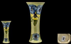 Walter Moorcroft Tube lined Tall Trumpet Shaped Vase ' Blue and Yellow Pansy ' Design on Pale