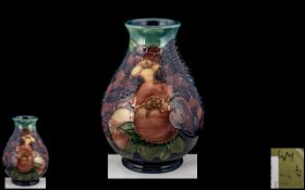 W. Moorcroft Ovoid Shaped Tube lined Vase ' Finches and Fruit ' Design. Designed by Sally Tuffin.